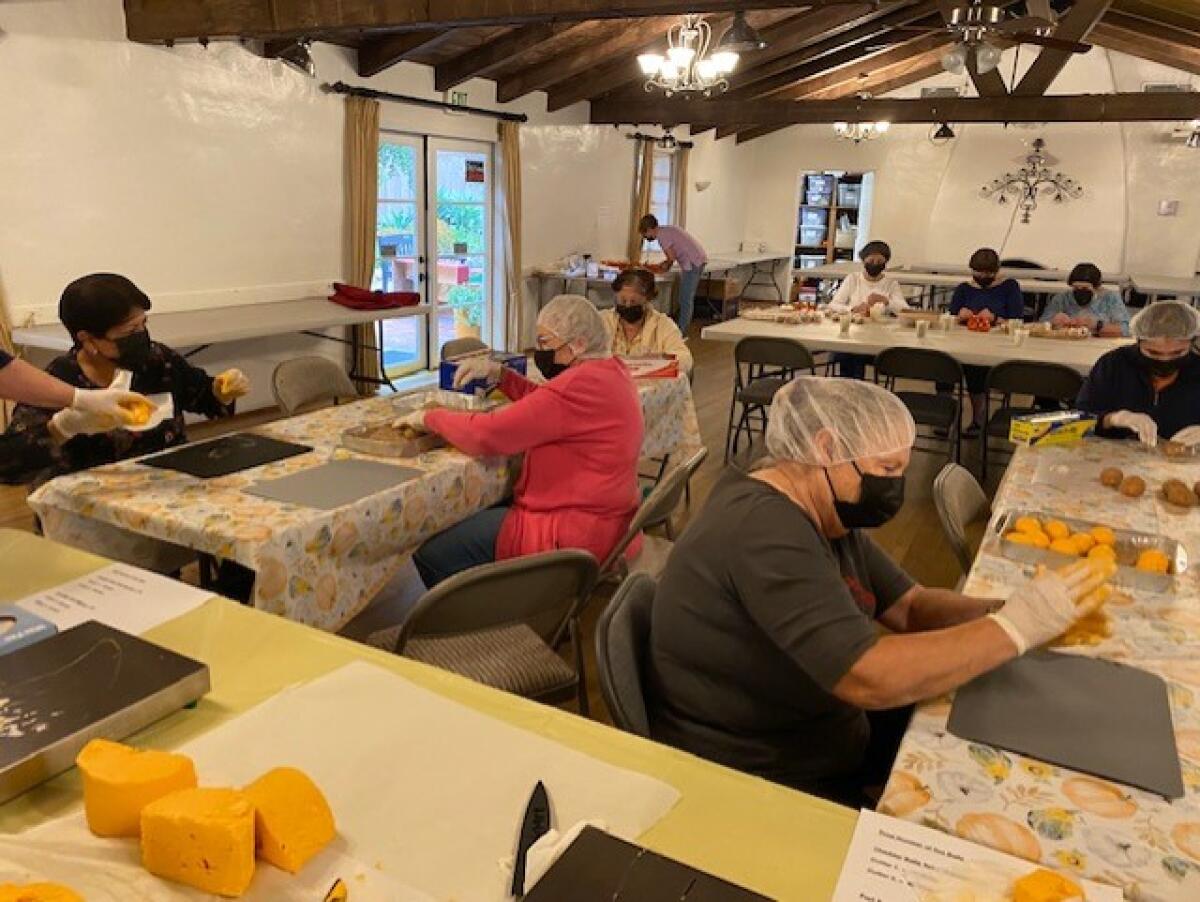 Some of the Sweetwater Woman's Club members making cheeseballs. 