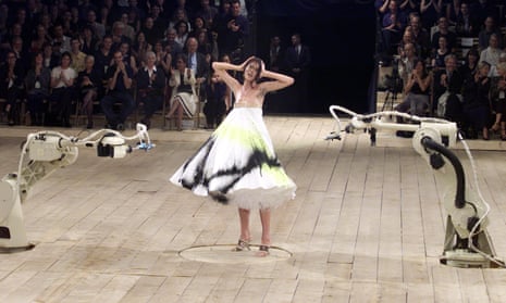 Model Shalom Harlow Having Her Dress Sprayed By Robots During The Alexander McQueen Show at London Fashion Week, 1998