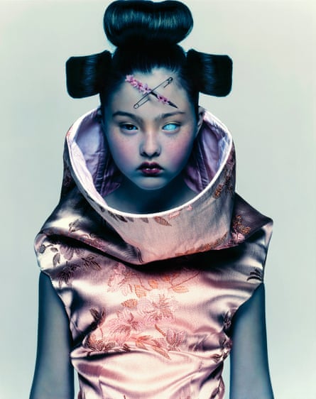 Devon Aoki modelling for Alexander McQueen, 1997, digitally altered to have a safety pin across her forehead and one blue robotic eye