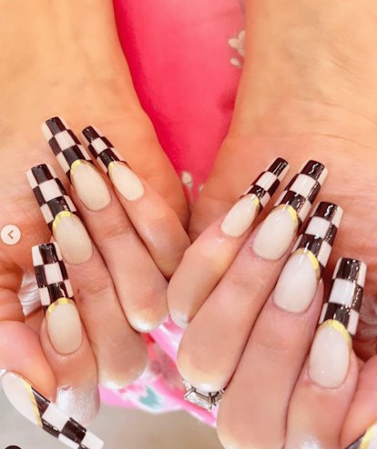 Gwen Stefani's checkerboard French tip nails are an on-trend nail design for Sagittarius season 2023...