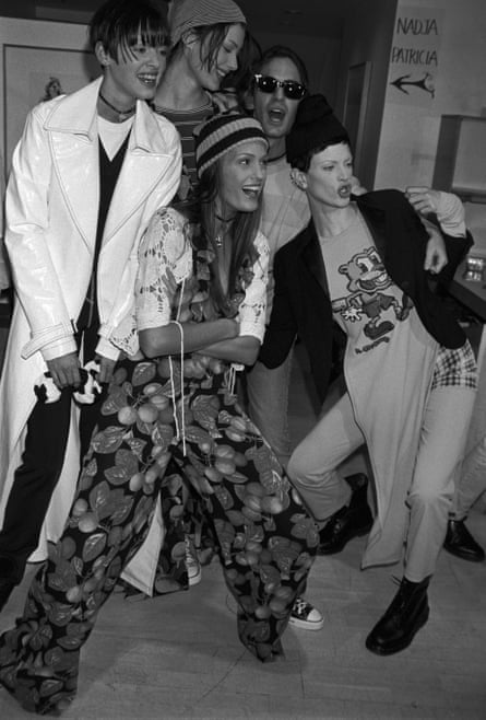 Models Shalom Harlow and Christy McMenamy with designer Marc Jacobs backstage at the Perry Ellis Spring/Summer 1993 show in New York