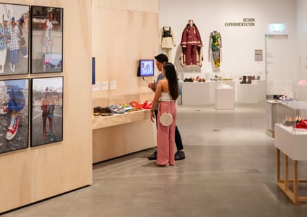 A display featuring three pairs of customised sneakers