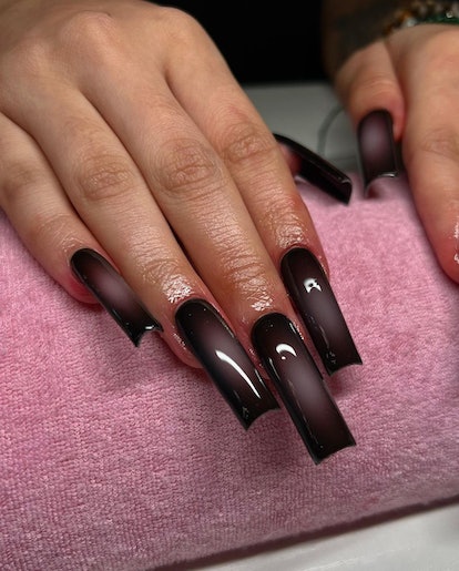 Dark academia aura nails embody the buzzy aesthetic.