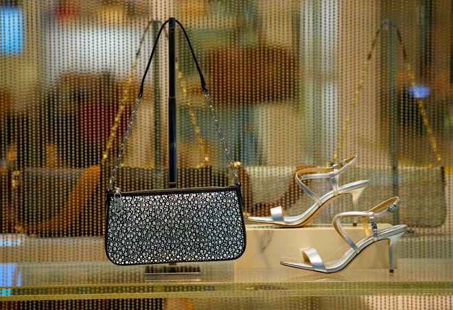 A window display in the Michael Kors store in Kenwood Towne Centre, Wednesday, Oct. 26, 2023. The store is located on the upper level above the foodcourt.