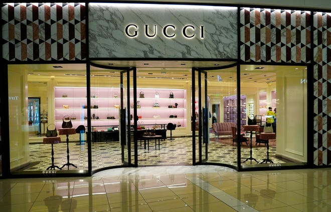 Purses on display at Gucci in Kenwood Towne Centre, Wednesday, Oct. 26, 2023. This is Gucci’s first location in Cincinnati. They opened in December of 2022, across from Louis Vuitton, near Nordstrom.