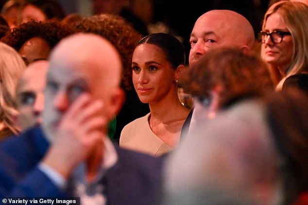 Meghan at a table during the ceremony held at the Italian restaurant Mother Wolf