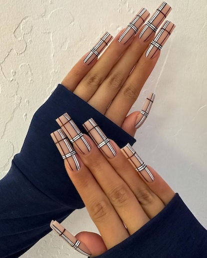 Burberry-inspired plaid print nails are an on-trend Thanksgiving nail design for 2023.