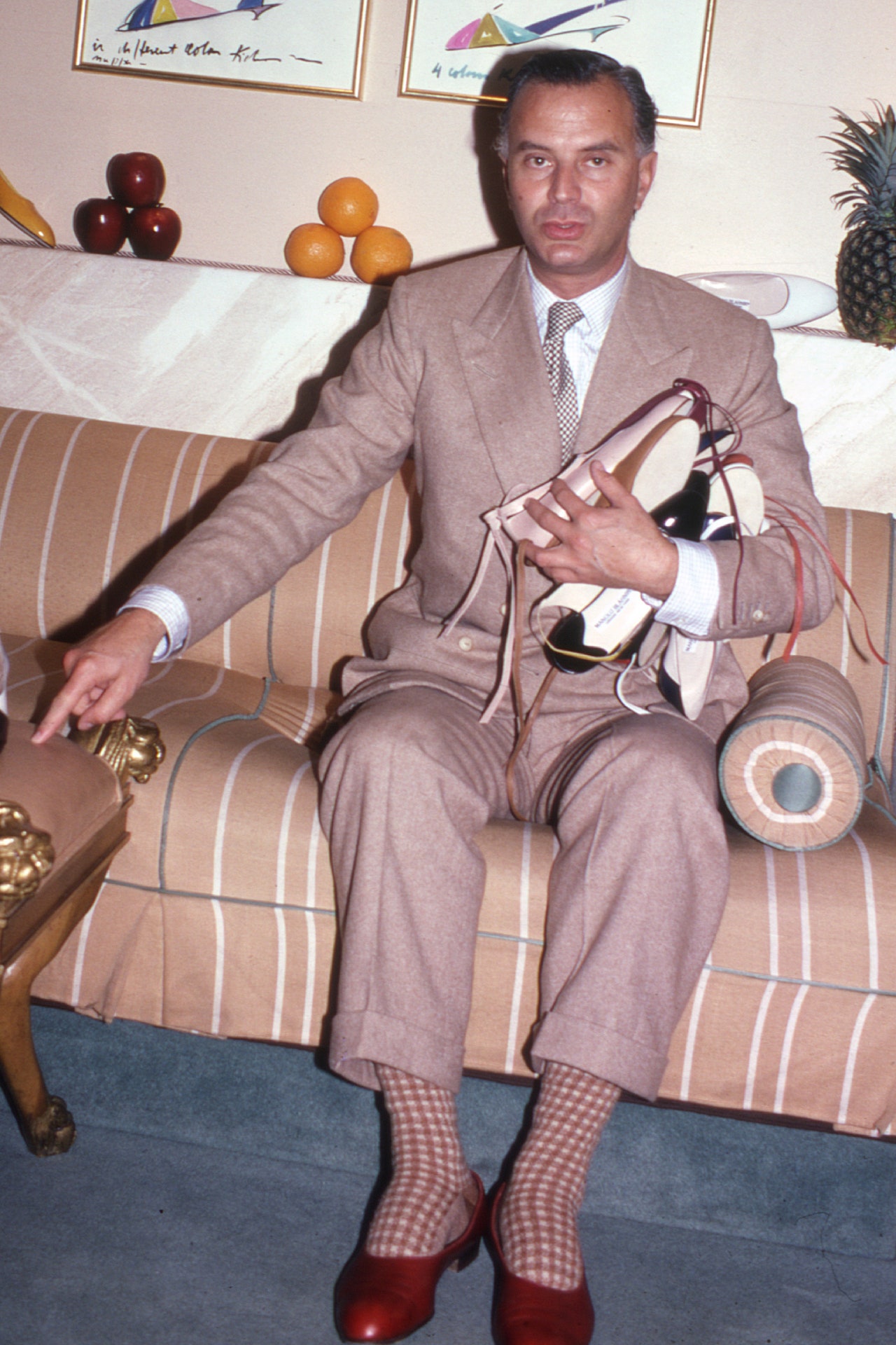 Manolo Blahnik wearing his signature opera pumps in New York 1982