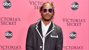 Future at Victoria's Secret Fashion Show, wearing a Black and white jacket, white shirt, and shades.