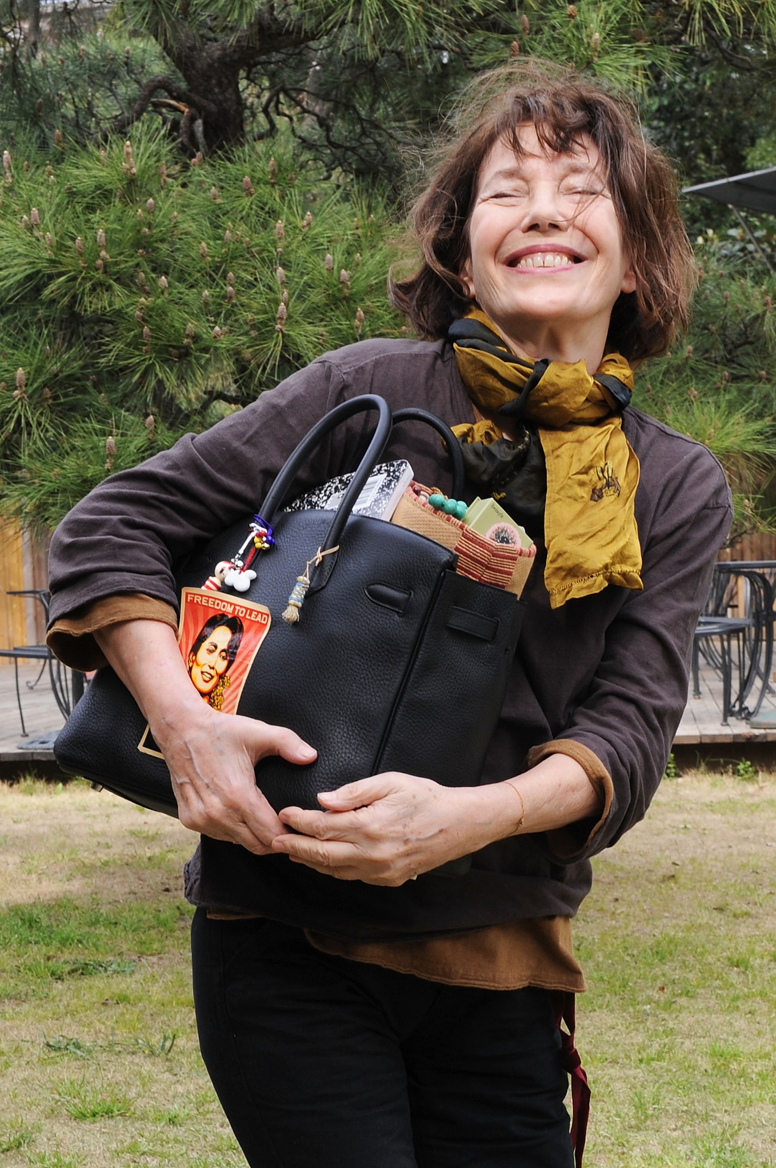 Jane Birkin with her signature overstuffed bag.