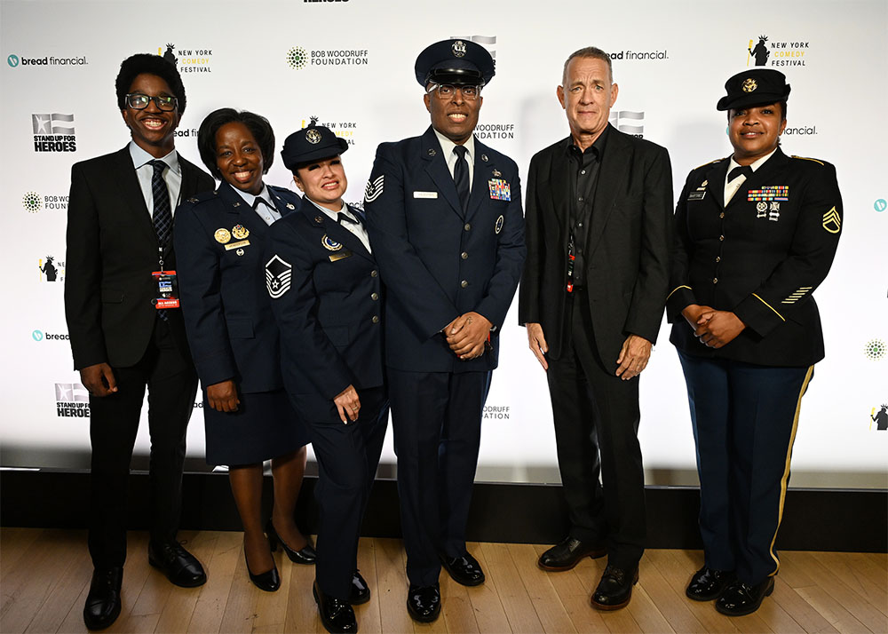 Tom Hanks center and Members of the Color Guard Formation attend the 17th Annual Stand Up For Heroes Benefit presented by Bob Woodruff Foundation and NY Comedy Festival at David Geffen Hall on November 06, 2023 in New York City.