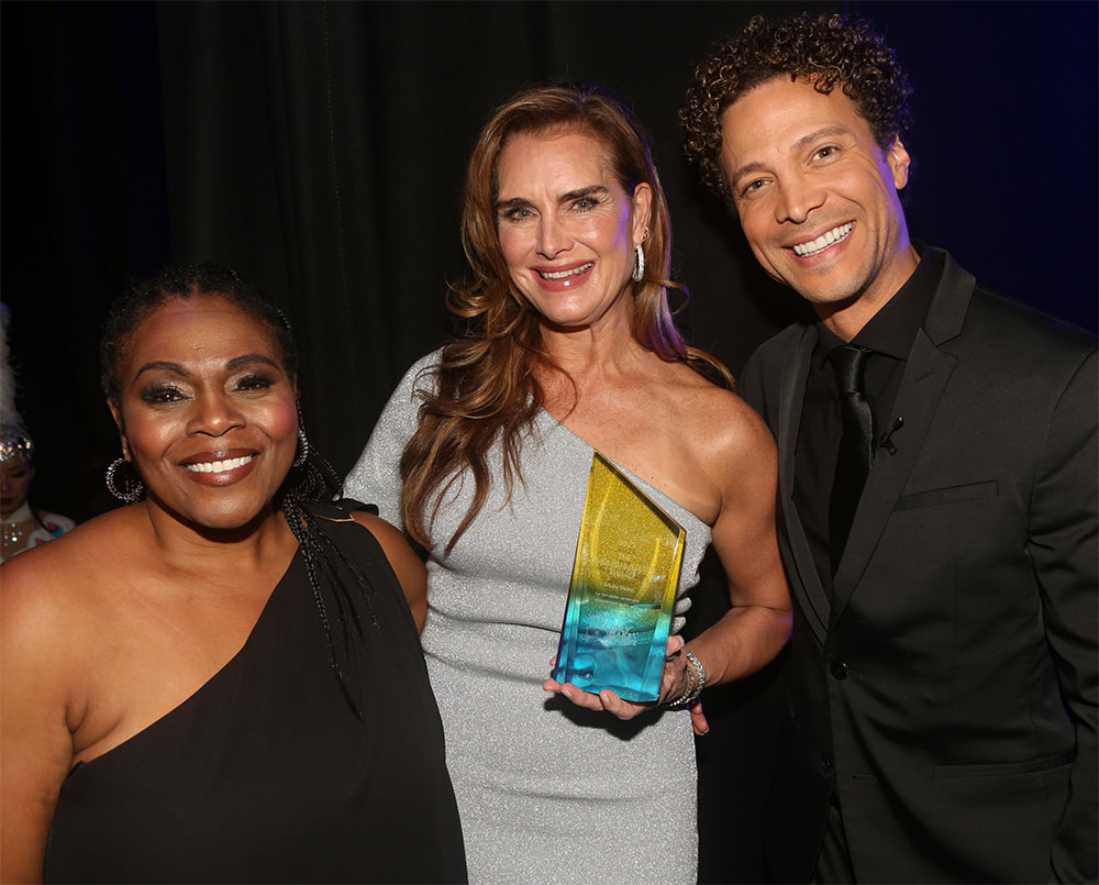 Only Make Believe Executive Artistic Director Tamela Aldridge, Brooke Shield and Host Justin Guarini pose at the 2023 Only Make Believe Gala honoring Brooke Shields at The Broadhurst Theatre on November 6, 2023 in New York City. Brooke Shields was presented with an award for advocacy and activism at the 2023 Only Make Believe Gala in New York on Monday Nov 6th. Only Make Believe brings theater into hospitals and special needs schools for children 100% free of charge.
