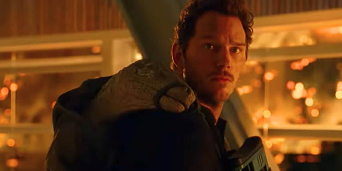 Owen Grady (Chris Pratt) with Beta the raptor on his back in 'Jurassic World Dominion'