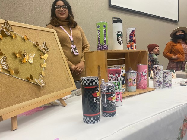 Isis Kahn recently changed her field of study from early childhood education to medicine and works for the Woodland Joint Unified School District. But she still finds time to create individually designed travel mugs.(Jim Smith/Daily Democrat)