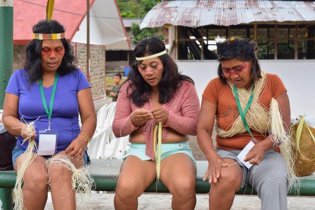 Rosa Gaba and fellow Waorani activists weave tops and bags from natural fibers. (Rebecca Wilson)