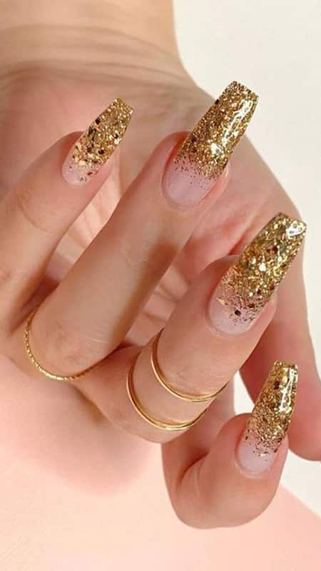 Glitter Nails: The glitter gradient adds a touch of drama, while the clear base keeps the look sophisticated.