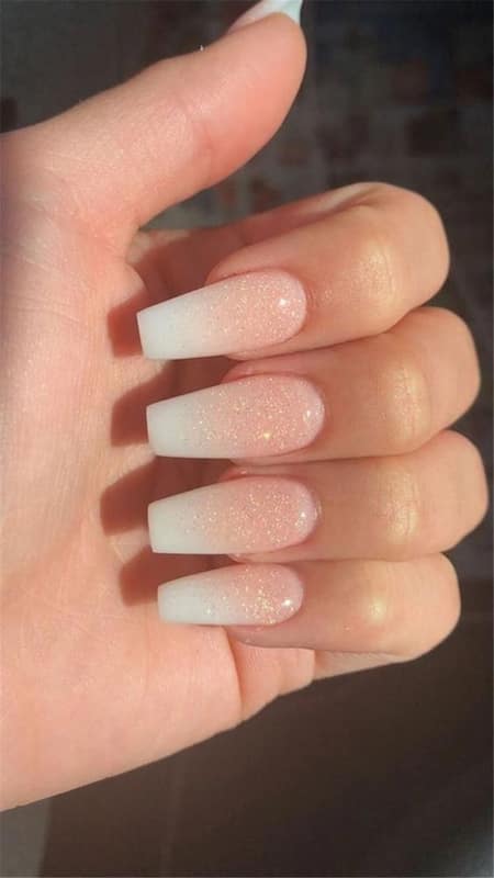 Ombre Nails With Glitter: This enchanting ombre nails embellished with a touch of glitter, adds an irresistible sparkle to your wedding