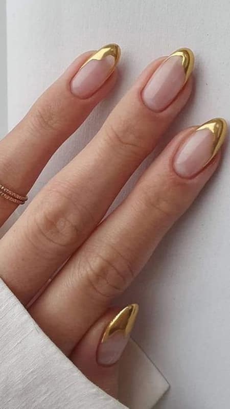 Golden French Nails: The golden chrome pigment adds a touch of luxury to the nails, while the French tip design keeps the look clean and chic.