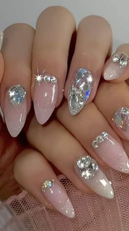 3D Jewel Nails: Add a touch of whimsy and elegance by scattering jewels randomly across your nails, creating a constellation of sparkle.