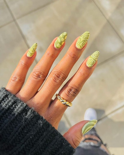 Patterned matcha nails.