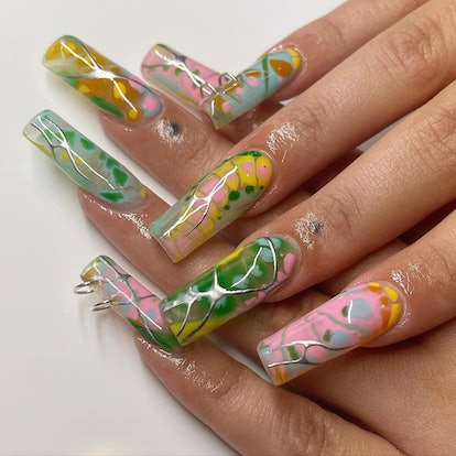 Groovy tie dye nails that were created using blooming gel polish.