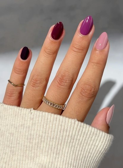 Purple Skittle nails are an on-trend nail design idea for Sagittarius season 2023.