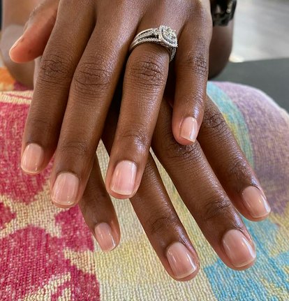 Sheer pink nails.