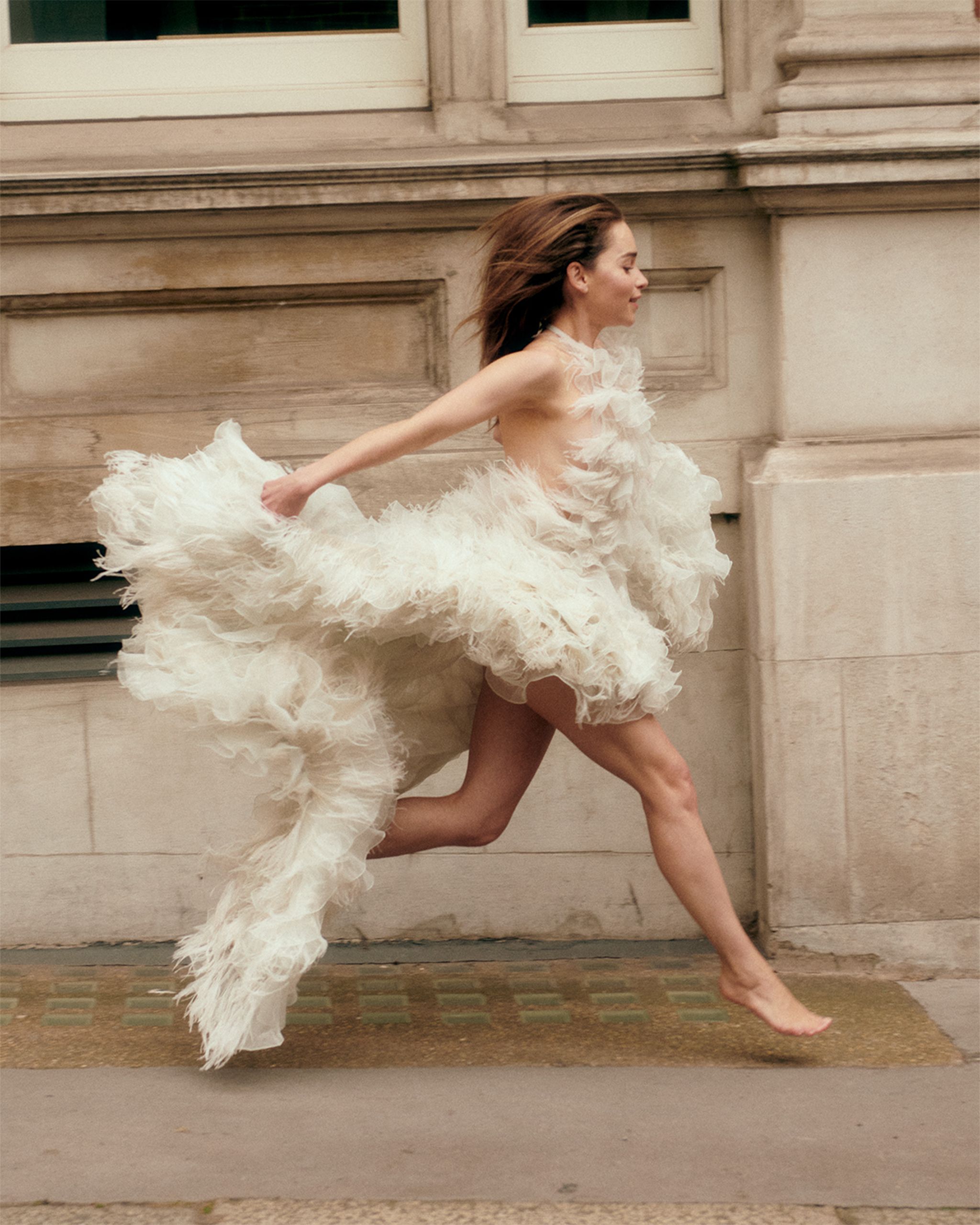 a person in a white dress dancing