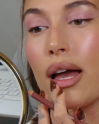 Hailey Bieber's chocolate brown crocodile-print nails are an on-trend Thanksgiving nail design for 2...