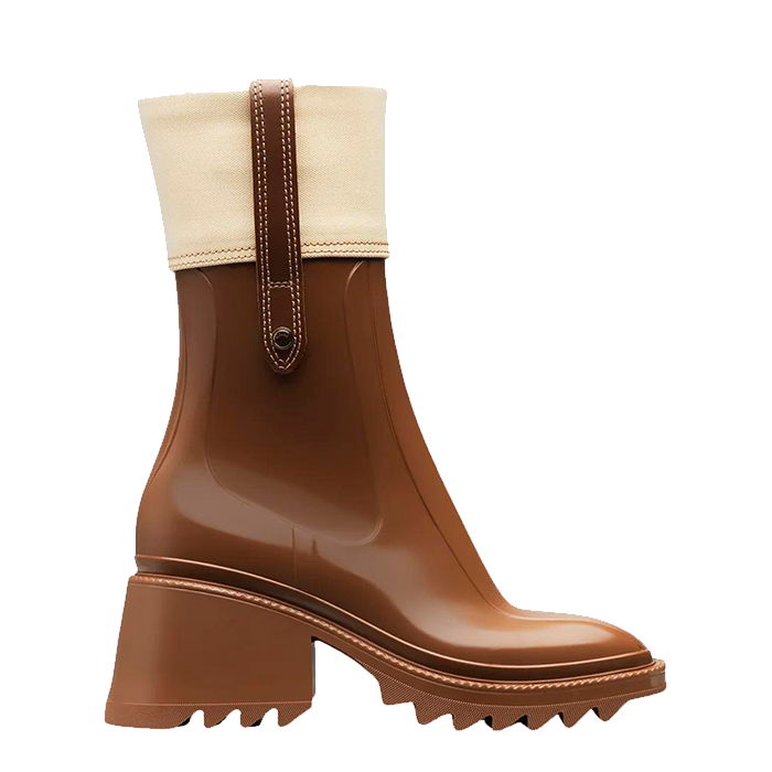 A tan-coloured boot with a chunky heal and a cream coloured detail at the top