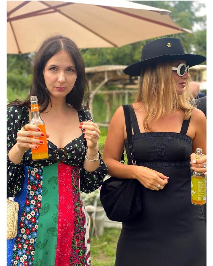 Lisa Wenske (left) in a Rixo dress purchased second-hand from Vestiaire Collective, with her sister in a vintage dress (Credit: Lisa Wenske)