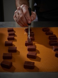 Rigor is key throughout the manufacturing process, whether the artisans are making a 75 percent dark chocolate or praline preparations