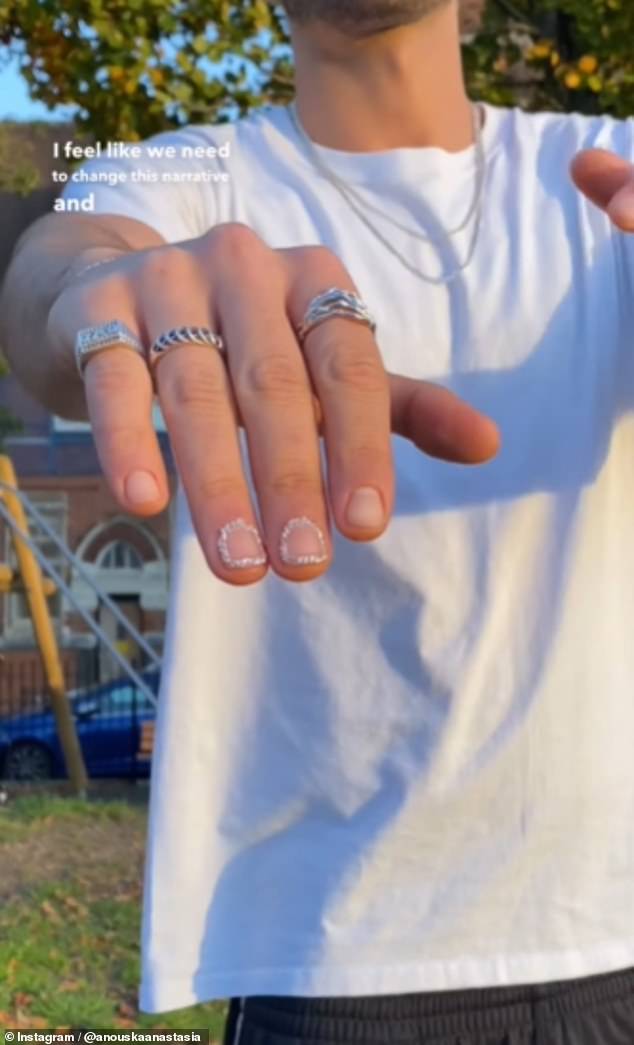 A nail technician has divided opinion on Instagram after sharing a unique manicure trend she designed for her male client (Pictured: An unnamed man poses with his freshly styled 'Chained Windows Men's Mani')