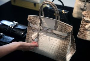 niloticus crocodile skin, diamonds, most expensive hermes birkin bags in the world, A Matte White Himalaya Niloticus Crocodile Diamond Birkin, with 18K gold and diamond hardware -- one of the most valuable handbags in the world -- sits on display during a preview at Christies in Hong Kong on May 4, 2016.