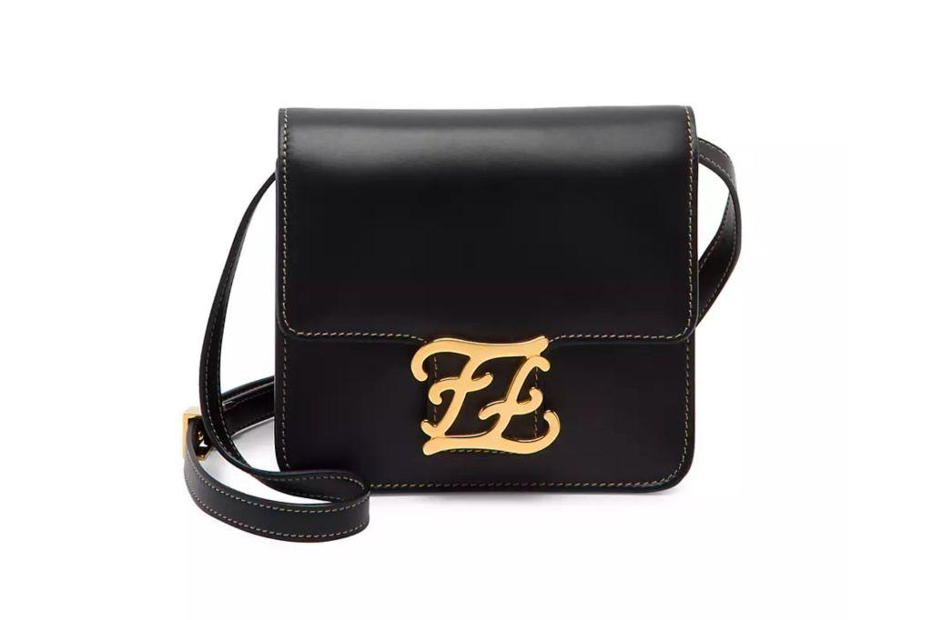 Black leather pocketbook with gold clasp.