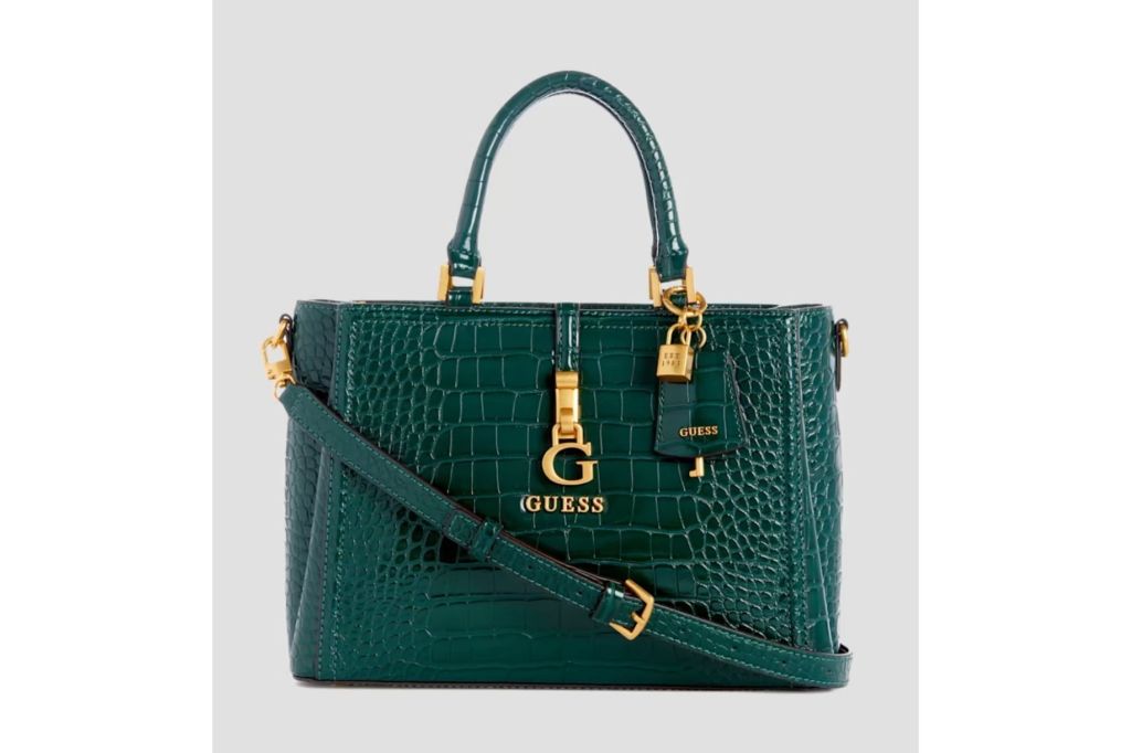 Green crocodile purse with gold details.