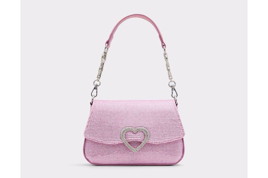 Pink purse with heart buckle and rhinestones.