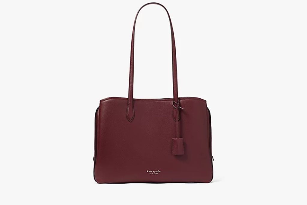 A burgundy tote bag from Kate Spade.