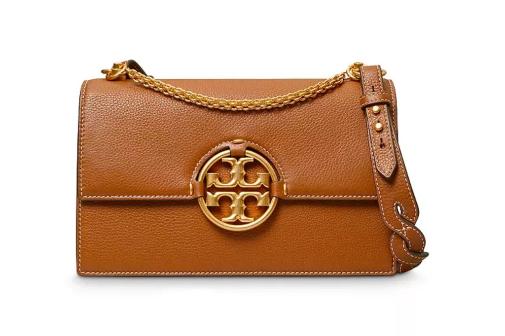 A brown leather crossbody bag with the Tory Burch logo.