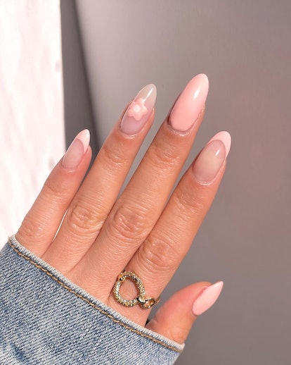 Mix-and-match pastel nail art is an on-trend peach fuzz nail design for 2024.