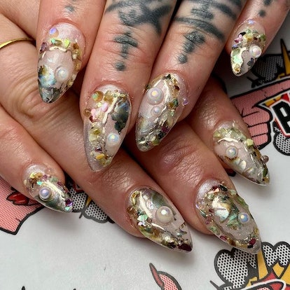 Realistic looking oyster nail art.