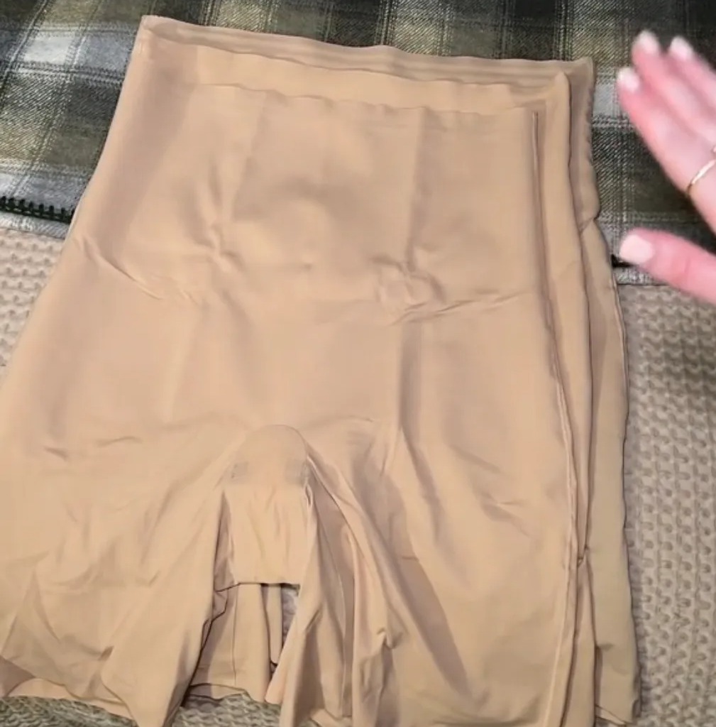 Tyler compared a newly bought pair of the shapewear shorts to older pairs which were all a size XL