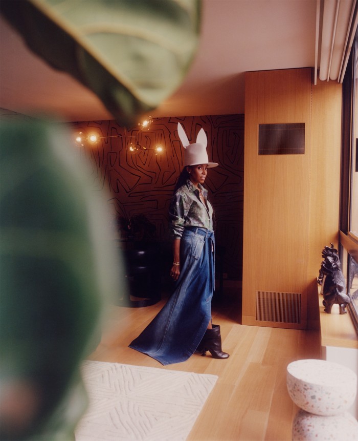 Ambrose wears Dries Van Noten, Loewe boots and a hat by Khia Tullae