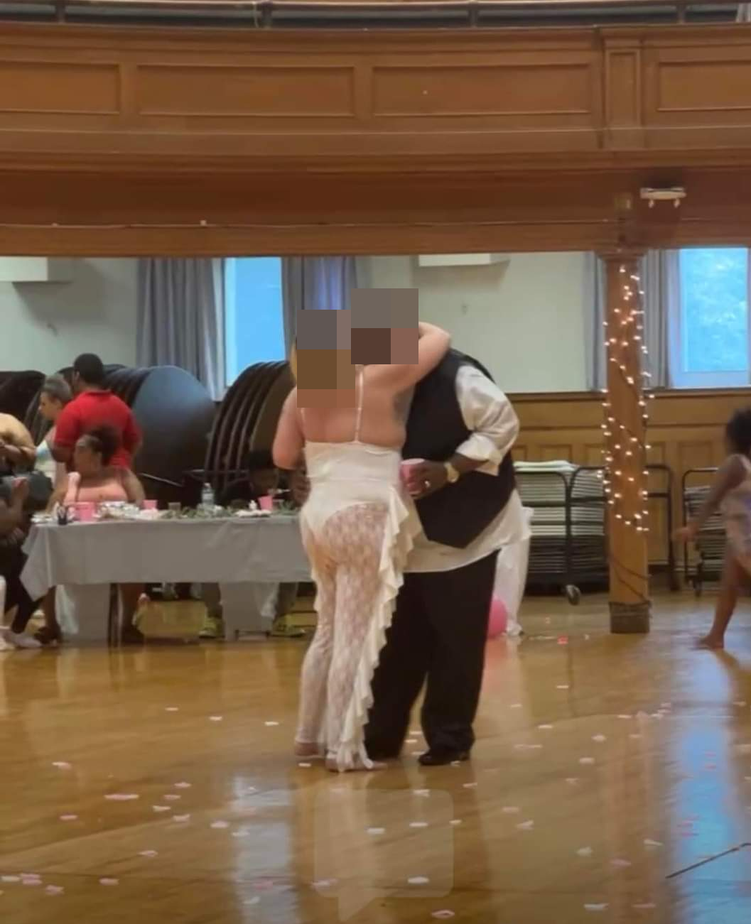 Her wedding outfit left very little to the imagination as she slow danced