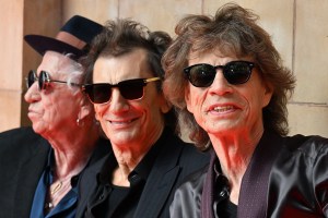 TOPSHOT - (L-R) Keith Richards, Ron Wood and Mick Jagger of legendary British rock band, The Rolling Stones pose as they arrive to attend a launch event for their new album, 