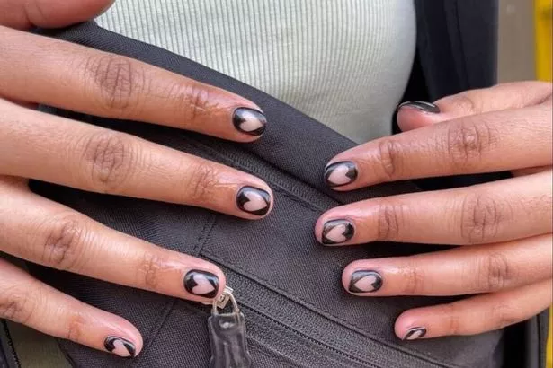Not into the traditional Valentine's designs? Opt for this edgy black nail art instead