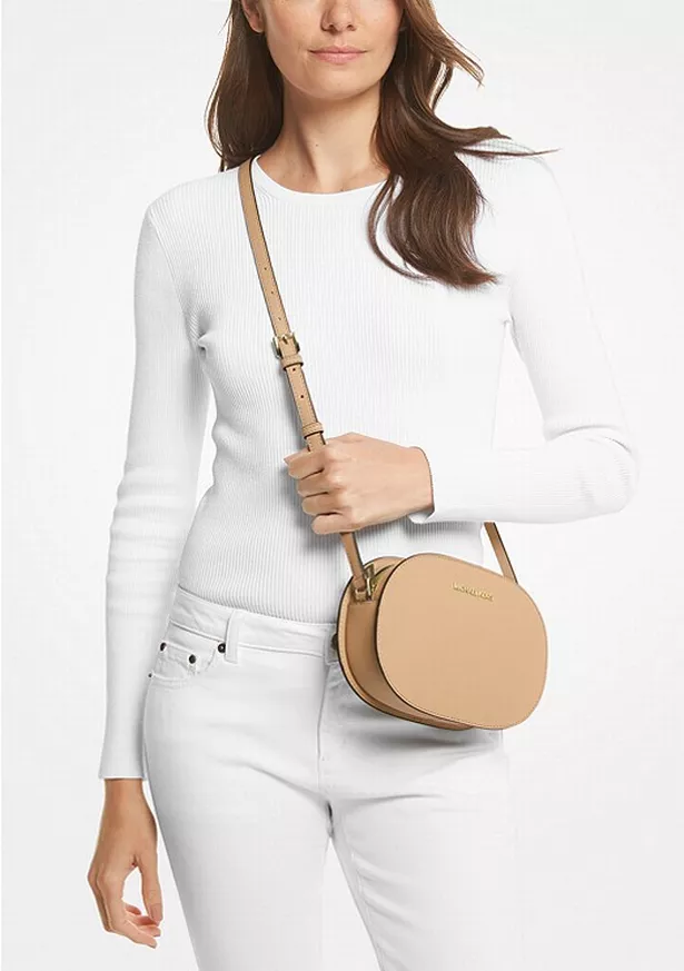 The Jet Set Travel Medium Saffiano Leather Crossbody Bag comes in four colours
