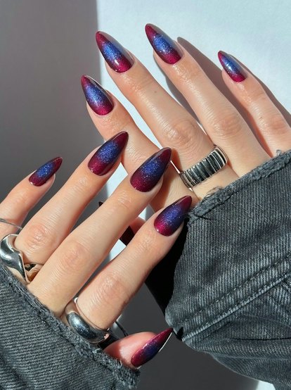 This glittering aura manicure is a unique take on the cat eye nail art trend.