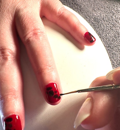 Christina Applegate rocked red nails with abstract croc print details at the 2024 Emmy Awards.