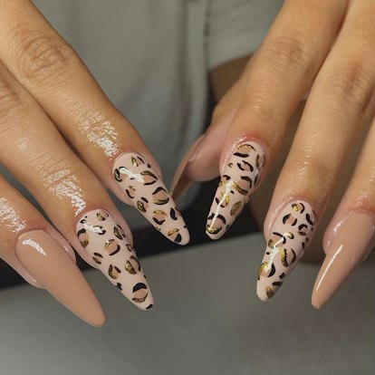 Leopard print nails match the mob wife aesthetic.